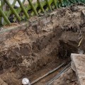 Can gas and water pipes go in the same trench?